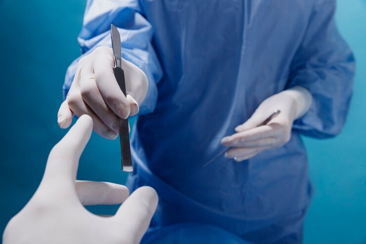 A doctor is giving medical scalpel in Operation Theatre